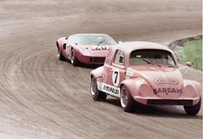 Pink Emerson Fittipaldi Beetle against Pink Ford GT40